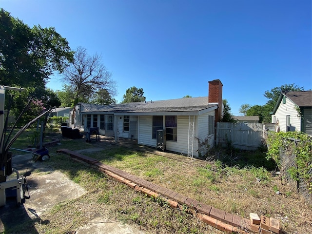 6812 Lakeside Dr, Lake Worth, TX 76135 - back of property featuring a chimney and a patio area