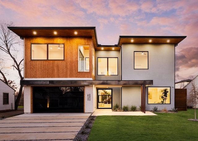 4603 Newmore Ave, Dallas, TX 75209 - modern home featuring driveway, a garage, a front yard, and stucco siding