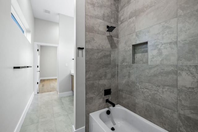 4603 Newmore Ave, Dallas, TX 75209 - bathroom featuring baseboards and bathing tub / shower combination