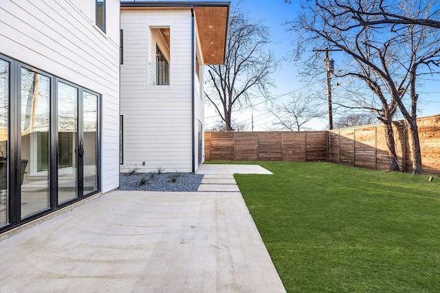 4603 Newmore Ave, Dallas, TX 75209 - fenced backyard with a patio area