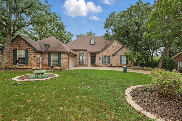1128 Bent Oaks Dr, Denton, TX 76210 - view of front of house with brick siding, an attached garage, and a front yard