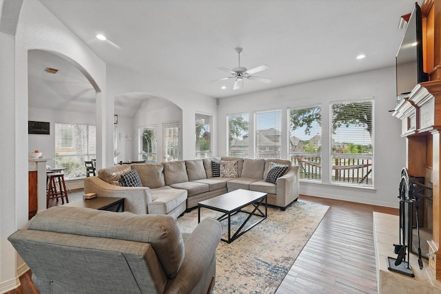 1128 Bent Oaks Dr, Denton, TX 76210 - living room with a ceiling fan, healthy amount of natural light, arched walkways, recessed lighting, and light wood-type flooring
