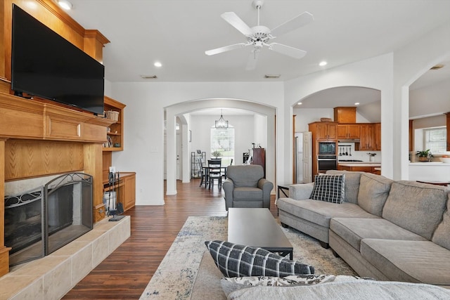 1128 Bent Oaks Dr, Denton, TX 76210 - living room featuring arched walkways, dark wood finished floors, plenty of natural light, a ceiling fan, and recessed lighting
