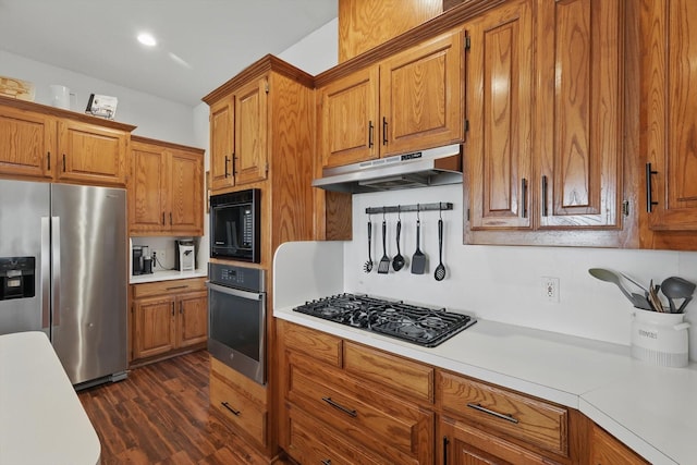 1128 Bent Oaks Dr, Denton, TX 76210 - kitchen with black appliances, under cabinet range hood, brown cabinetry, and light countertops