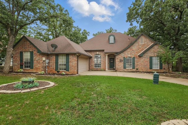 1128 Bent Oaks Dr, Denton, TX 76210 - view of front of property with an attached garage, brick siding, concrete driveway, and a front yard