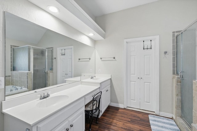 1128 Bent Oaks Dr, Denton, TX 76210 - bathroom featuring double vanity, a shower stall, wood finished floors, a garden tub, and recessed lighting