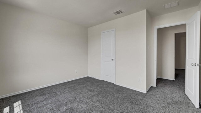 414 Drake Dr, Ferris, TX 75125 - unfurnished bedroom featuring dark colored carpet