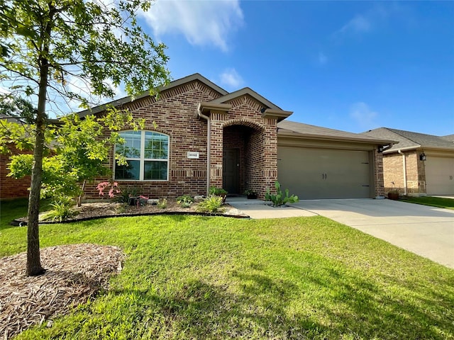 1092 Decker Dr, Fate, TX 75189 - view of front of home featuring brick siding, an attached garage, concrete driveway, and a front lawn