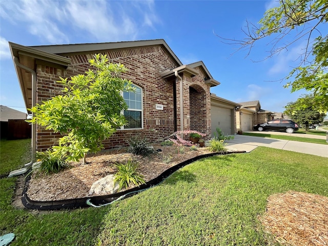 1092 Decker Dr, Fate, TX 75189 - view of front of house with brick siding, a garage, concrete driveway, and a front yard