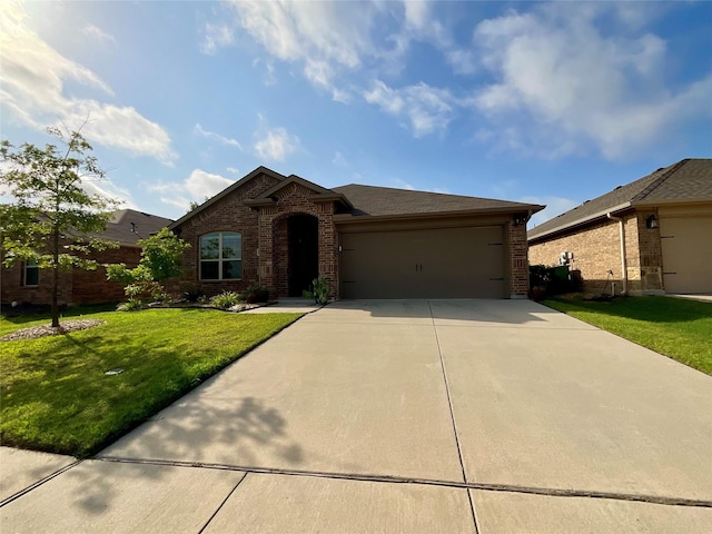 1092 Decker Dr, Fate, TX 75189 - view of front of house with brick siding, driveway, an attached garage, and a front yard