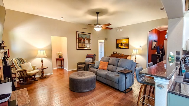 8901 Arbor Crest Ct, Fort Worth, TX 76179 - living room with arched walkways, hardwood / wood-style flooring, and a ceiling fan