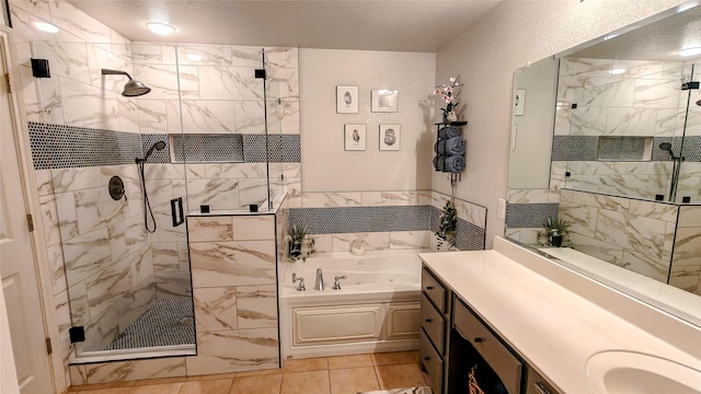 8901 Arbor Crest Ct, Fort Worth, TX 76179 - bathroom with a bath, a shower stall, vanity, a textured wall, and tile patterned floors