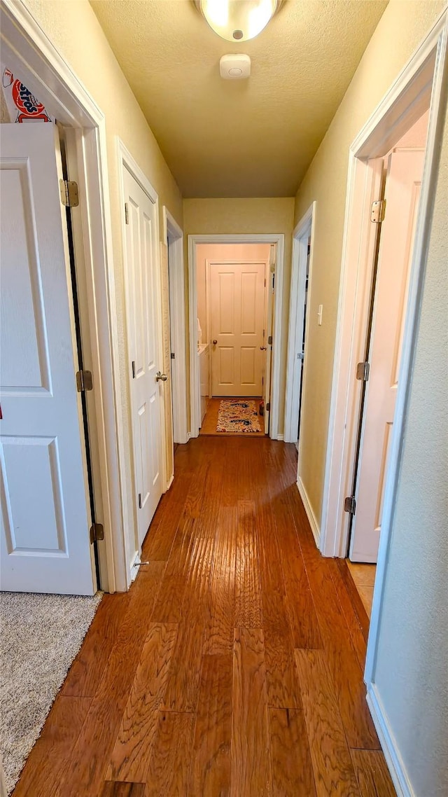 8901 Arbor Crest Ct, Fort Worth, TX 76179 - hallway featuring hardwood / wood-style floors and baseboards