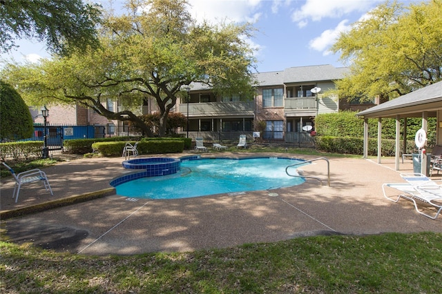 3101 Townbluff Dr Unit 822, Plano, TX 75075 - view of swimming pool with a patio area and a pool with connected hot tub