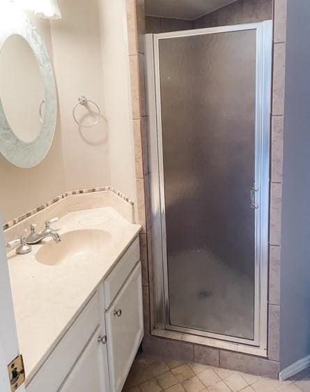 3101 Townbluff Dr Unit 822, Plano, TX 75075 - bathroom with vanity, a stall shower, and tile patterned flooring