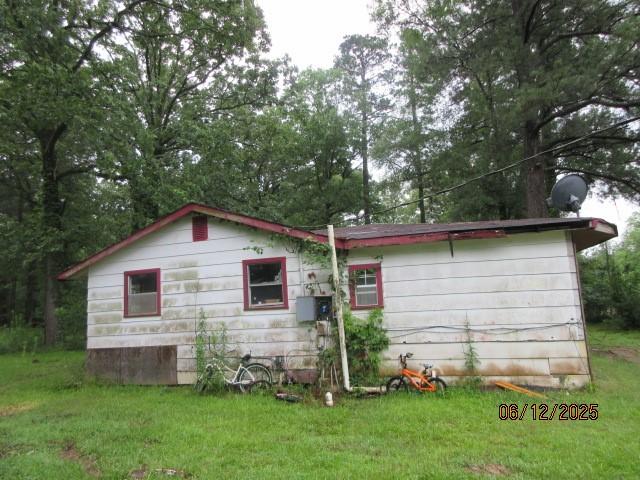 3779 Jones Rd, Haughton, LA 71037 - rear view of property featuring a yard
