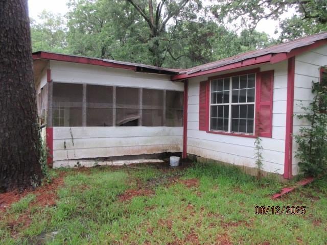 3779 Jones Rd, Haughton, LA 71037 - view of home's exterior with a sunroom