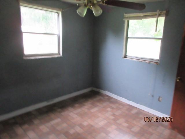 3779 Jones Rd, Haughton, LA 71037 - unfurnished room with ceiling fan and brick patterned flooring
