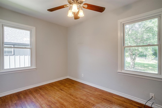 4944 Royal Dr, Fort Worth, TX 76116 - unfurnished room featuring healthy amount of natural light, light wood finished floors, and ceiling fan