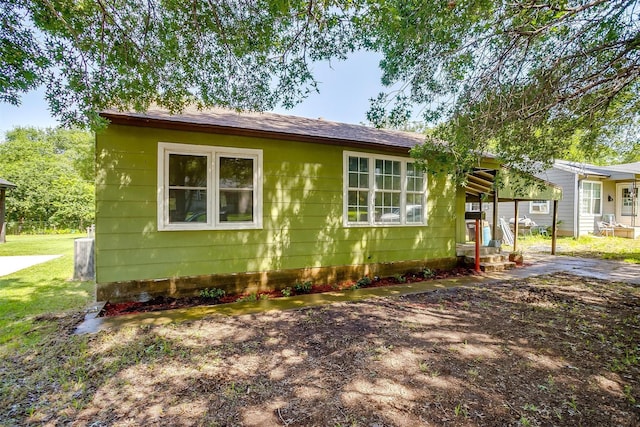 4944 Royal Dr, Fort Worth, TX 76116 - view of side of home with roof with shingles