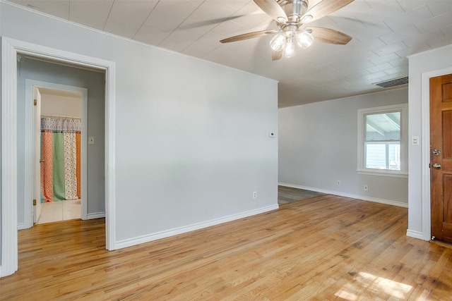 4944 Royal Dr, Fort Worth, TX 76116 - spare room featuring a ceiling fan, wood finished floors, and ornamental molding