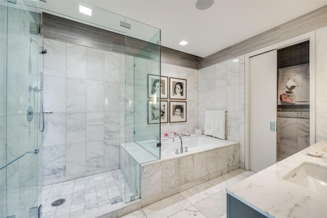 1918 Olive St Unit 502, Dallas, TX 75201 - full bathroom with a bath, a stall shower, vanity, and tile walls
