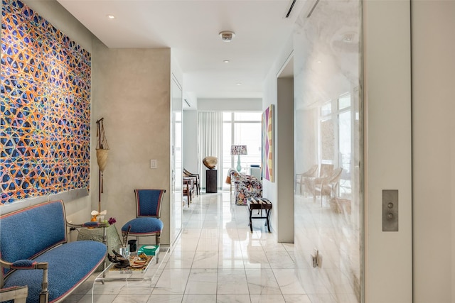 1918 Olive St Unit 502, Dallas, TX 75201 - hallway featuring light marble finish flooring