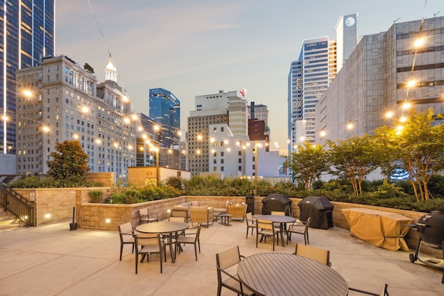 1200 Main St Unit 1106, Dallas, TX 75202 - view of patio featuring area for grilling, a city view, and outdoor dining area