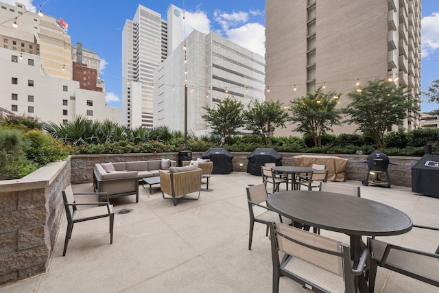 1200 Main St Unit 1106, Dallas, TX 75202 - view of patio / terrace featuring an outdoor hangout area, grilling area, and a city view