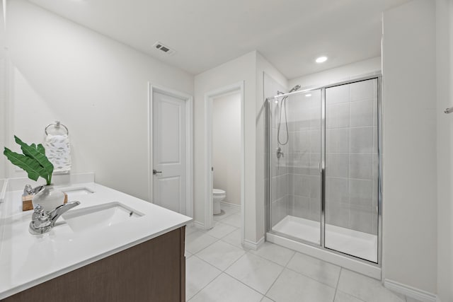 523 Summit Pass Ln, Princeton, TX 75407 - bathroom with tile patterned floors, a shower stall, double vanity, and recessed lighting