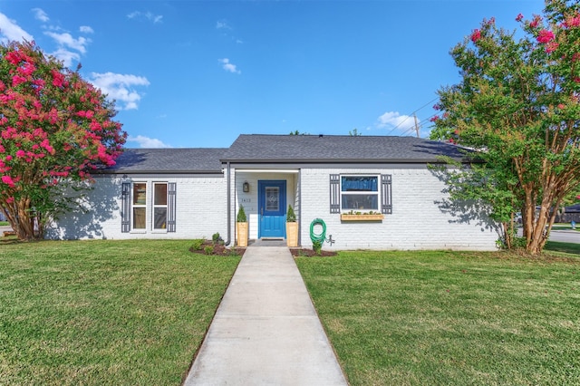 1413 White Way, Mckinney, TX 75069 - view of front of property with a front yard, brick siding, and a shingled roof