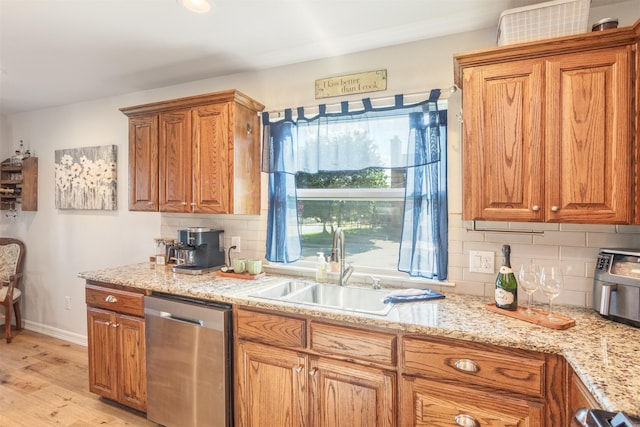 1413 White Way, Mckinney, TX 75069 - kitchen with dishwasher, tasteful backsplash, light wood-type flooring, brown cabinetry, and light stone counters