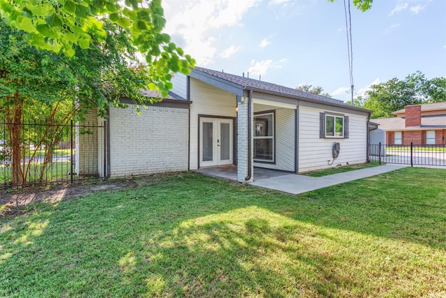 1413 White Way, Mckinney, TX 75069 - back of property featuring french doors, a patio area, and brick siding