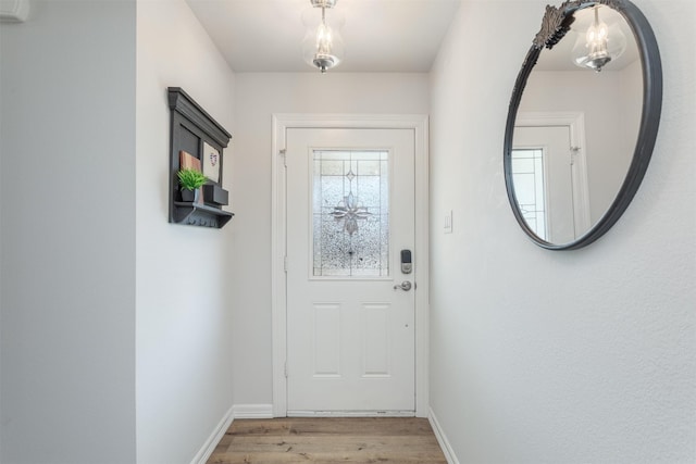 1413 White Way, Mckinney, TX 75069 - entryway featuring light wood-type flooring and baseboards