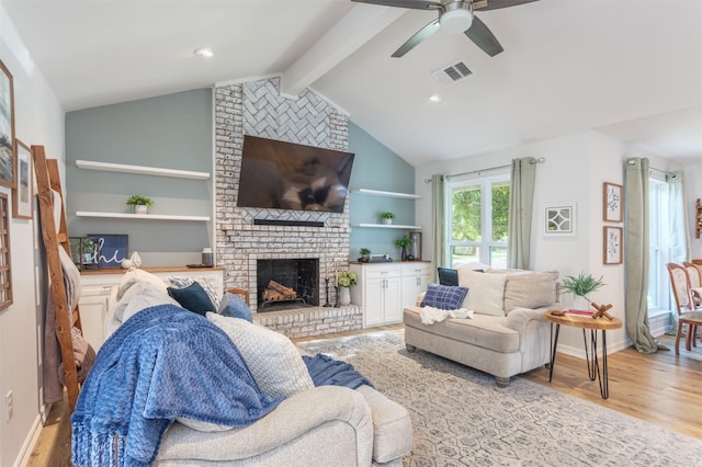 1413 White Way, Mckinney, TX 75069 - living room with a brick fireplace, a ceiling fan, and light wood-style floors