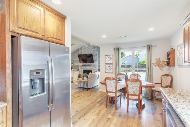 1413 White Way, Mckinney, TX 75069 - dining area featuring light wood-style flooring, a fireplace, and recessed lighting