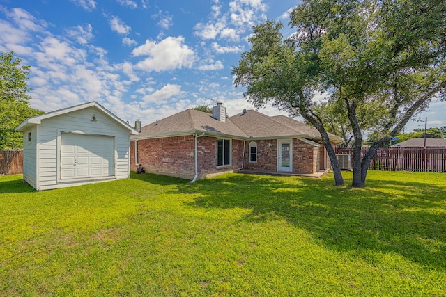 6508 Running Creek Dr, Arlington, TX 76001 - back of property with a garage, an outbuilding, brick siding, a shingled roof, and a chimney