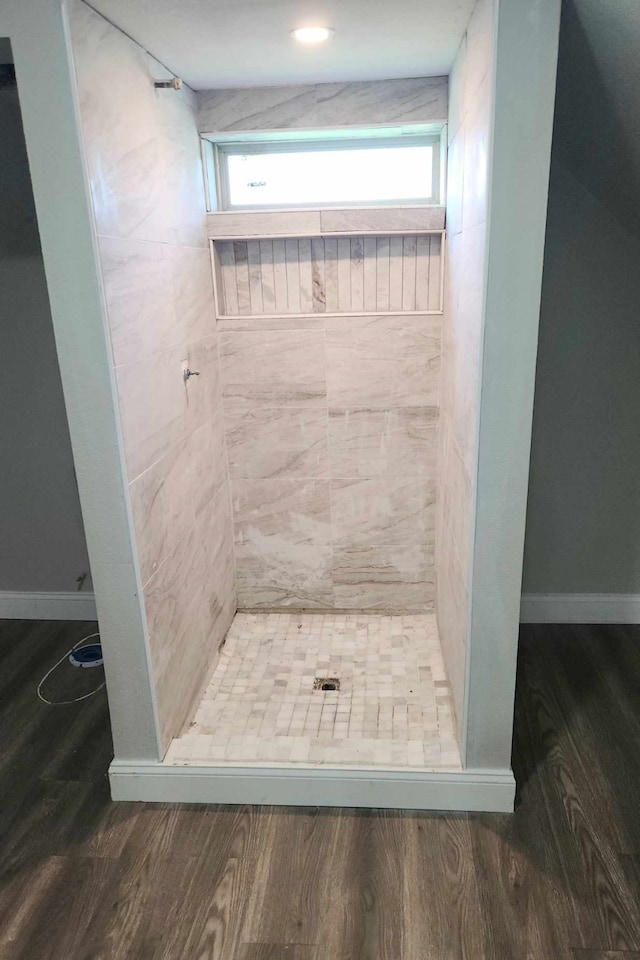 104 College St, Royse City, TX 75189 - bathroom with wood finished floors, a stall shower, and plenty of natural light