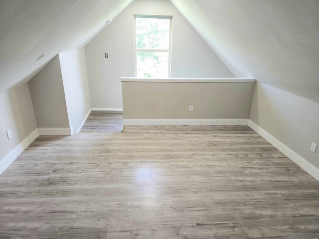 104 College St, Royse City, TX 75189 - bonus room with lofted ceiling and wood finished floors