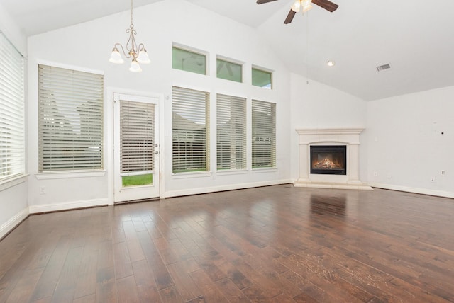 937 Nathanael Greene Ct, Aubrey, TX 76227 - unfurnished living room featuring a chandelier, ceiling fan, a glass covered fireplace, wood-type flooring, and high vaulted ceiling