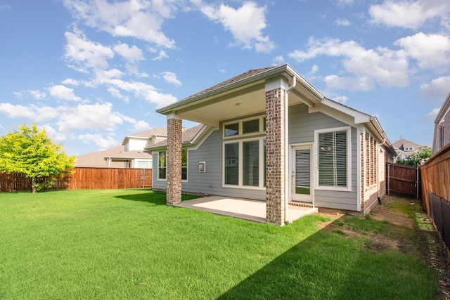 937 Nathanael Greene Ct, Aubrey, TX 76227 - rear view of house with a fenced backyard, a patio area, and brick siding