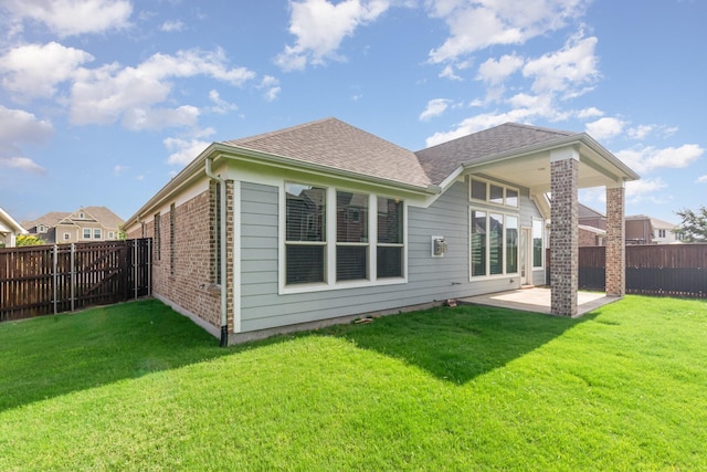 937 Nathanael Greene Ct, Aubrey, TX 76227 - rear view of house with a patio, a fenced backyard, brick siding, and roof with shingles
