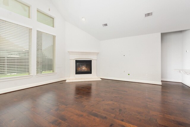 937 Nathanael Greene Ct, Aubrey, TX 76227 - unfurnished living room with lofted ceiling, wood-type flooring, and a glass covered fireplace