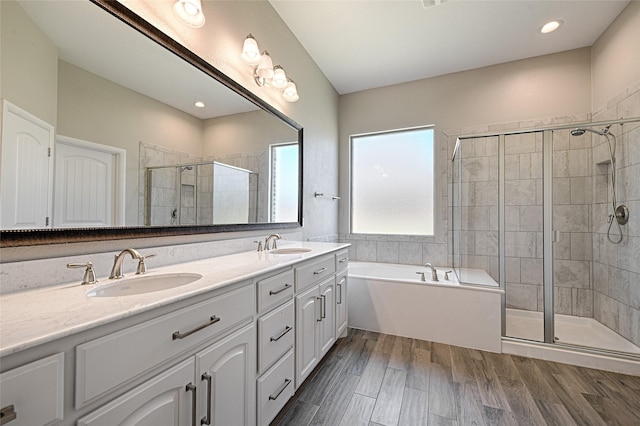 233 Cross Fox Ln, Aledo, TX 76008 - bathroom with double vanity, a stall shower, a bath, and wood finished floors