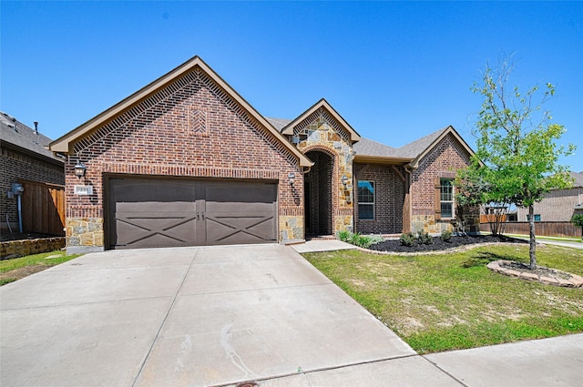 233 Cross Fox Ln, Aledo, TX 76008 - view of front of home with stone siding, brick siding, driveway, and an attached garage