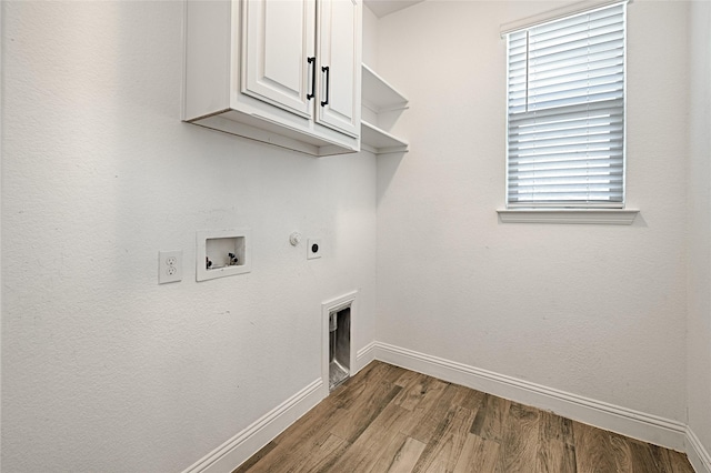 233 Cross Fox Ln, Aledo, TX 76008 - laundry area featuring cabinet space, wood finished floors, hookup for a washing machine, and hookup for an electric dryer
