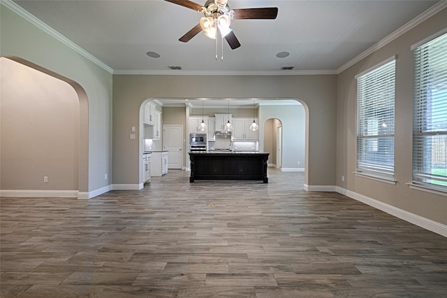 233 Cross Fox Ln, Aledo, TX 76008 - unfurnished living room featuring arched walkways, ceiling fan, dark wood-style flooring, and ornamental molding