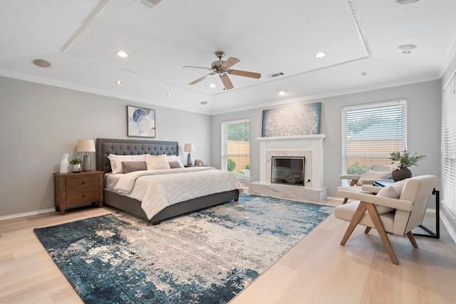 6104 Bluff Point Dr, Dallas, TX 75248 - bedroom with light wood-style floors, ornamental molding, a high end fireplace, recessed lighting, and ceiling fan
