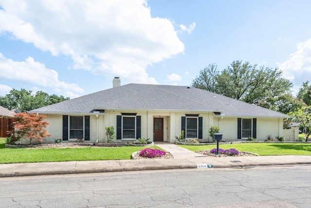 6104 Bluff Point Dr, Dallas, TX 75248 - ranch-style home with brick siding, a chimney, a front lawn, and a shingled roof