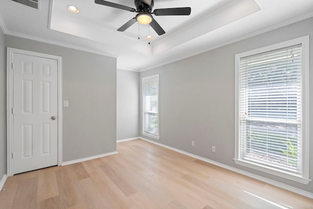 6104 Bluff Point Dr, Dallas, TX 75248 - spare room featuring light wood-style flooring, a raised ceiling, ceiling fan, recessed lighting, and ornamental molding